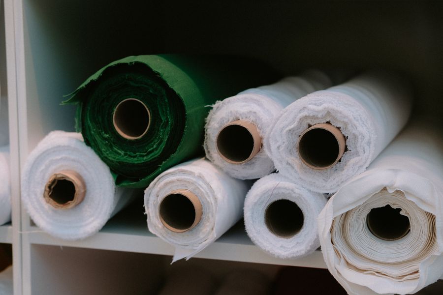Rolls of PVC coated fabric on storage racks